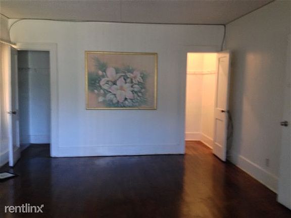 master bedroom with walk in closets