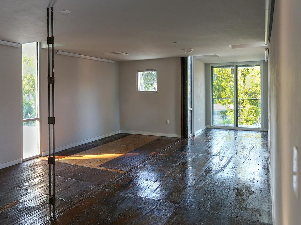 Interior of upstairs shipping container office with balcony. $1000/mo