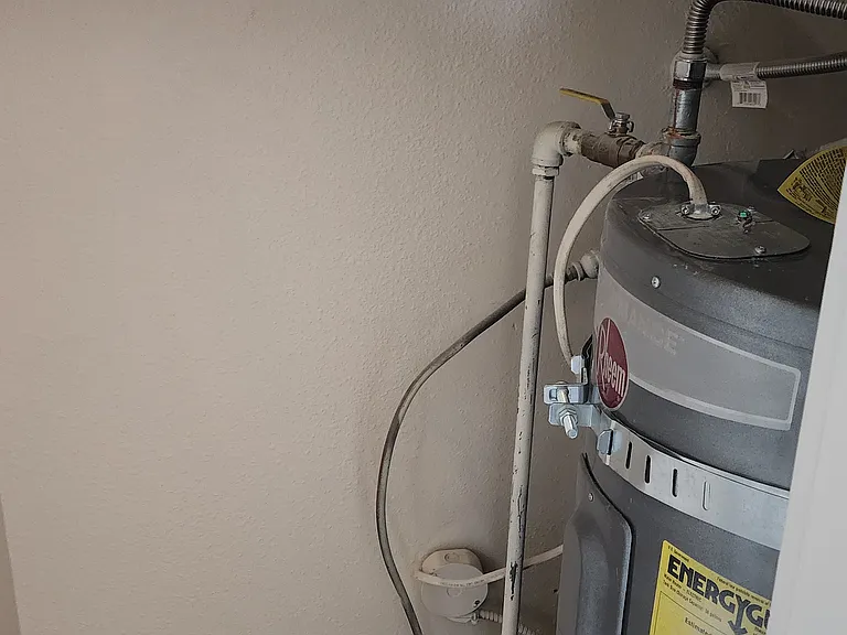 Coat closet with hot water heater