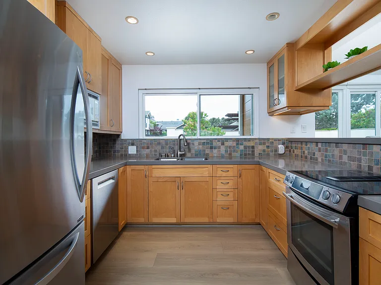 Fully equipped kitchen with stainless refrigerator and dishwasher!