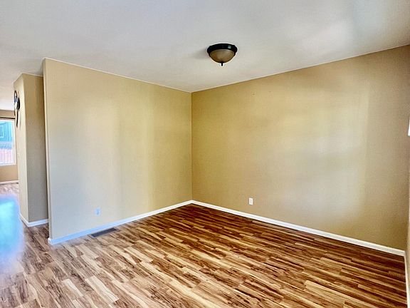 The living room is spacious and inviting, offering a comfortable and modern space for relaxation and gatherings.