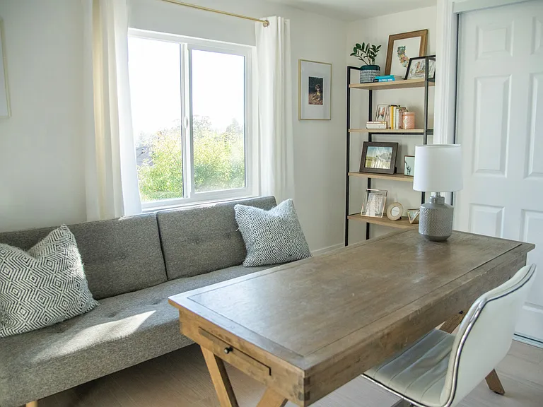 Office/flex space with west elm futon (also included is a memory foam mattress topper and extra sheets/linens and blankets for an occasional guest)
