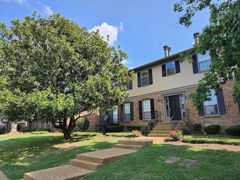 Entrance to foyer & stairs. Love that Magnolia tree.