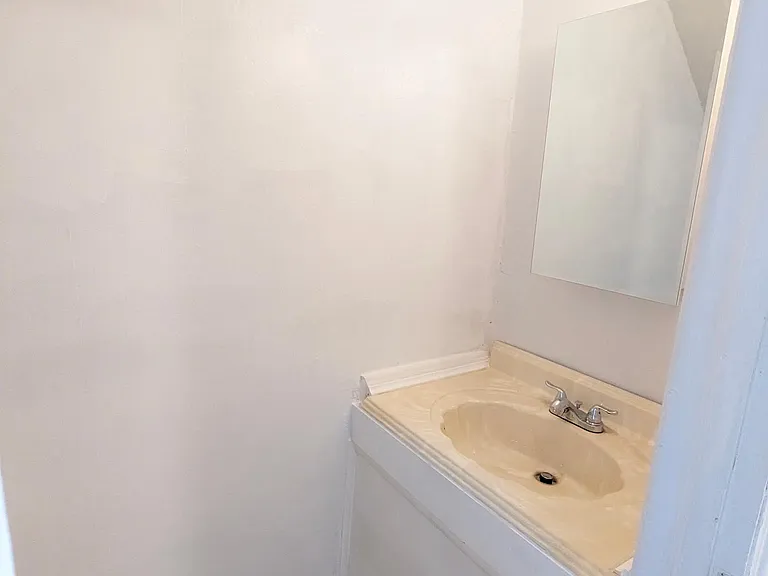 Half a bath in the basement. Newly renovated.