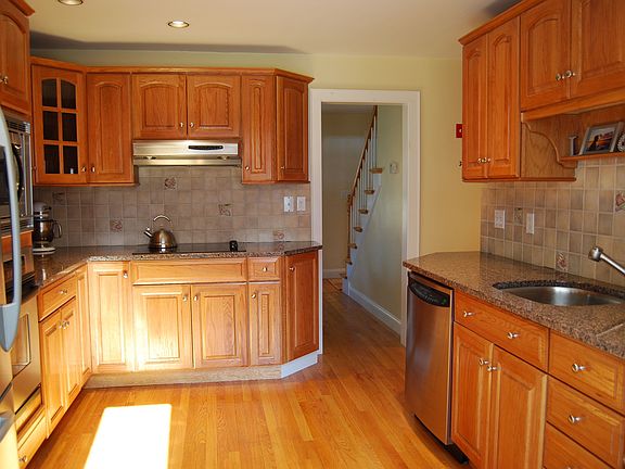 Kitchen features granite countertops, stainless appliances, Shrock cabinetry.