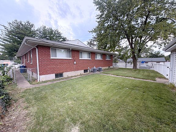 Brick exterior and gated side yard