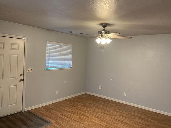Entry door and living with ceiling fan
