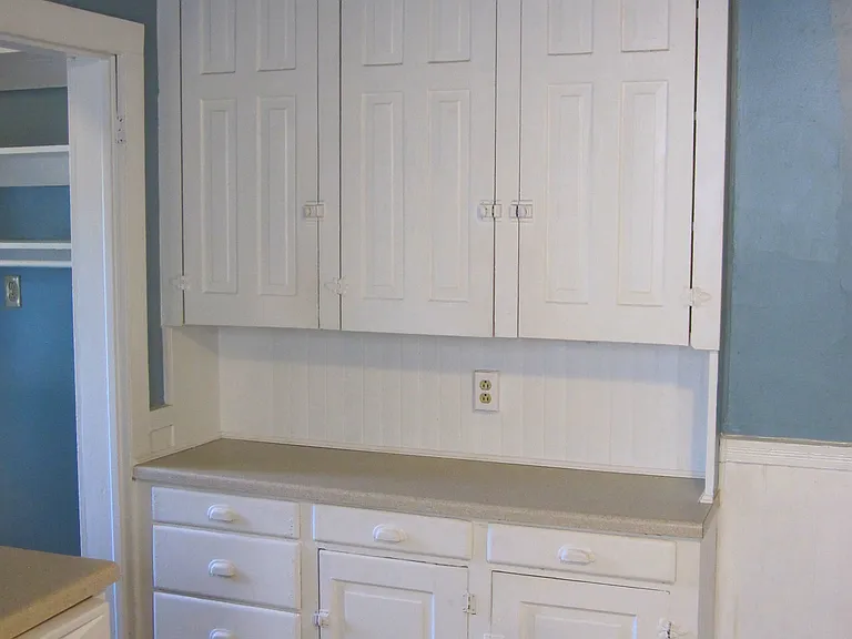 Tall cabinets with plenty of space and new countertops.