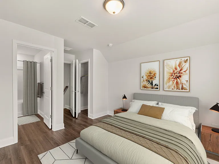 Sun-drenched secondary bedroom with a queen bed.