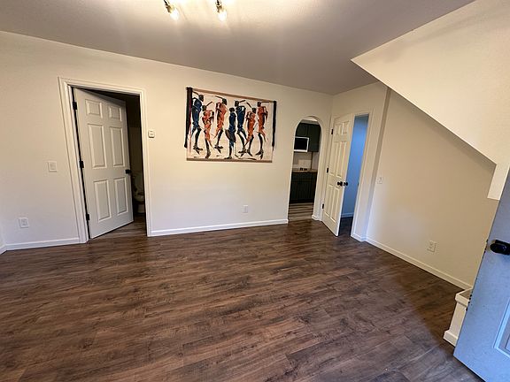 Wider view of living area. Left door leads to bathroom.