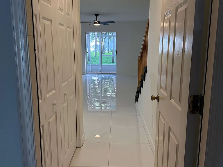 View as you enter the first floor bedroom / theater / office with ensuite bathroom from the garage