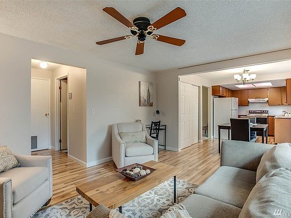 Enjoy the open concept uniting the family room, dining room and kitchen! Gorgeous brand new flooring!