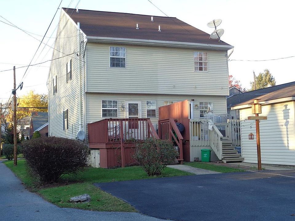 Rear with deck and shed 