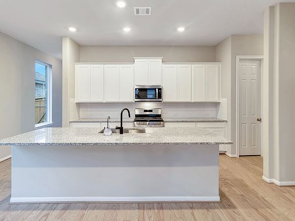Kitchen. Sample product photo - actual exterior and interior selections may vary by homesite