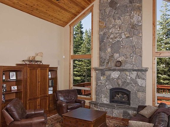"Magnificent floor to ceiling hearth with gas fireplace"