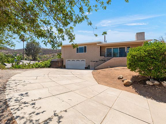Driveway leading up to the garage . There is a workshop right off of the garage or 4th bedroom