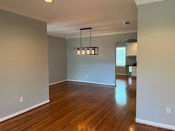 View of dining area from formal living, with office/study beyond dining room.