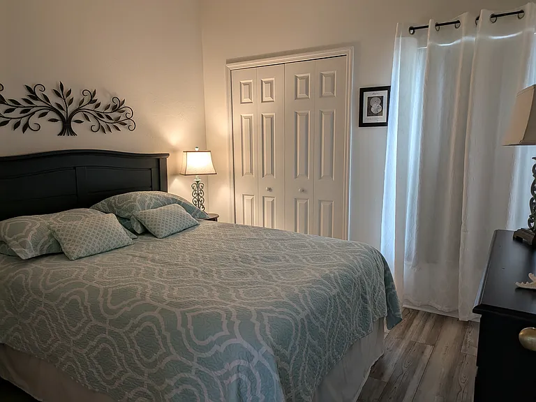 Bedroom #2 
Black out shades + curtains in front window