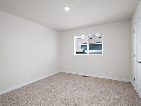The secondary bedroom has carpet