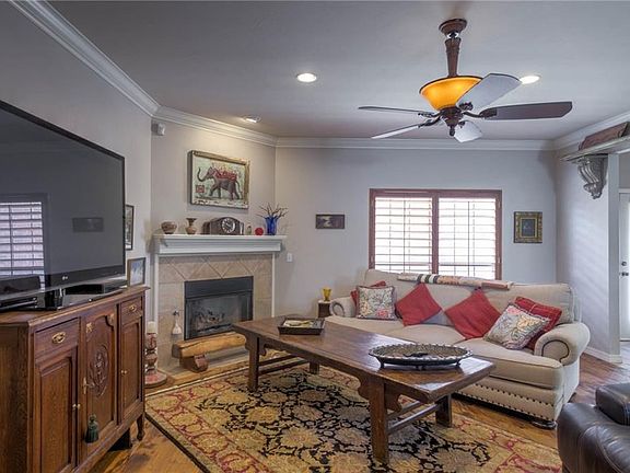 Large living room with fireplace and gas logs. The wood floors are spectacular - pecan and hickory. 