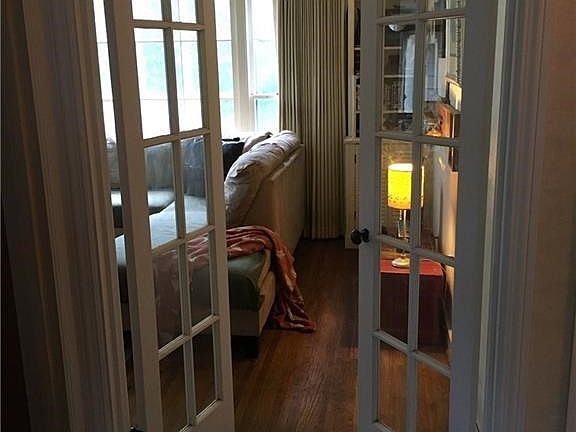 French doors outside living room - step into hallway towards kitchen or either of two main floor bedrooms.