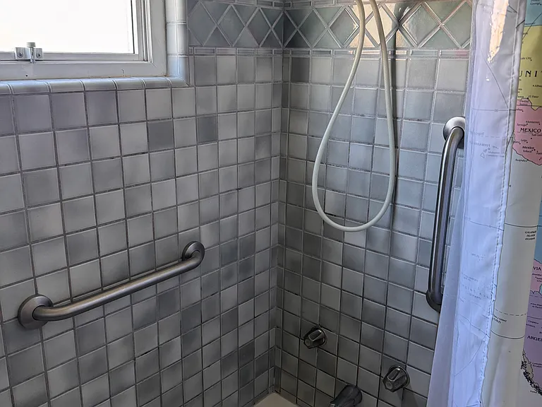 Bathtub and shower.