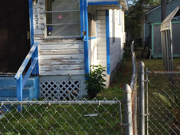 Fenceline down right of hous