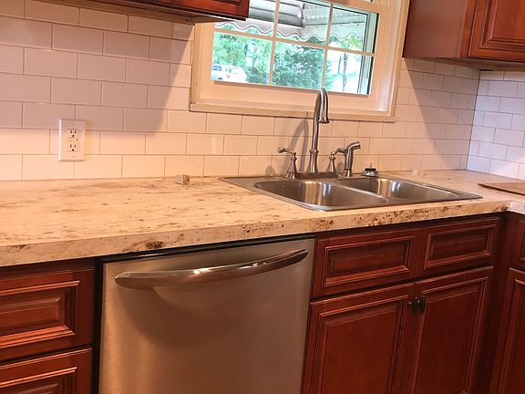 New kitchen cabinets, ceramic backsplash, countertops and ap