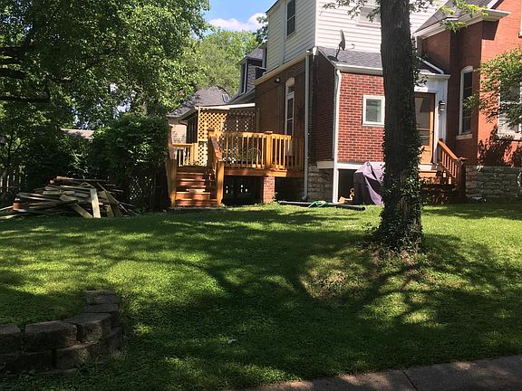 Side view with deck and side storm porch entrance