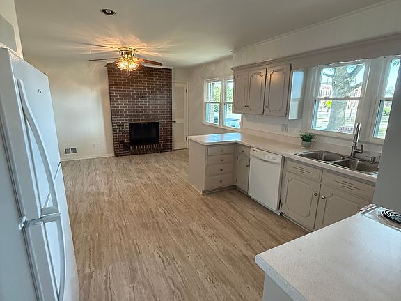 Kitchen with hearth sitting area