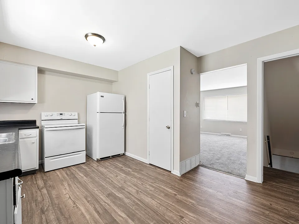modern kitchen fully equipped with a fridge, oven, stove, and dishwasher for everyday convenience
