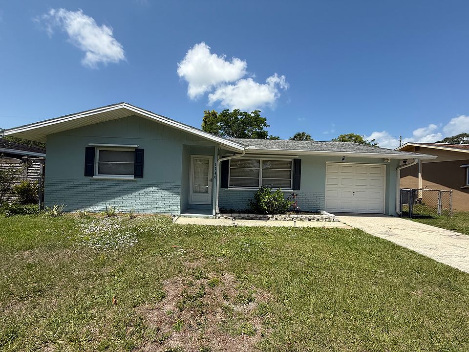 Front view of home and driveway.