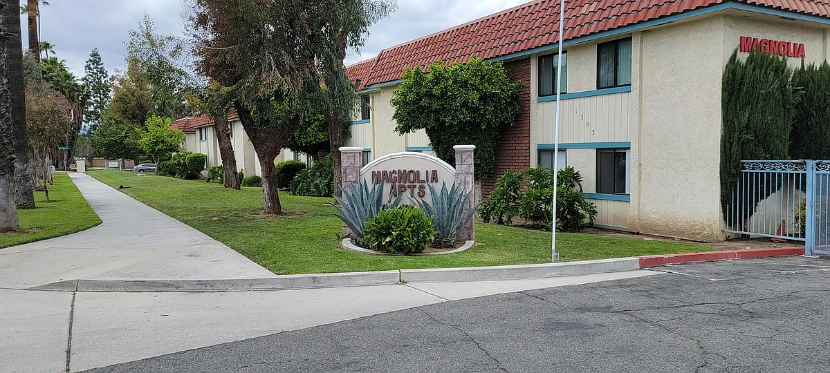 Gated enterance at Magnolic Apartments in Riverside, CA. - Magnolia Apartments