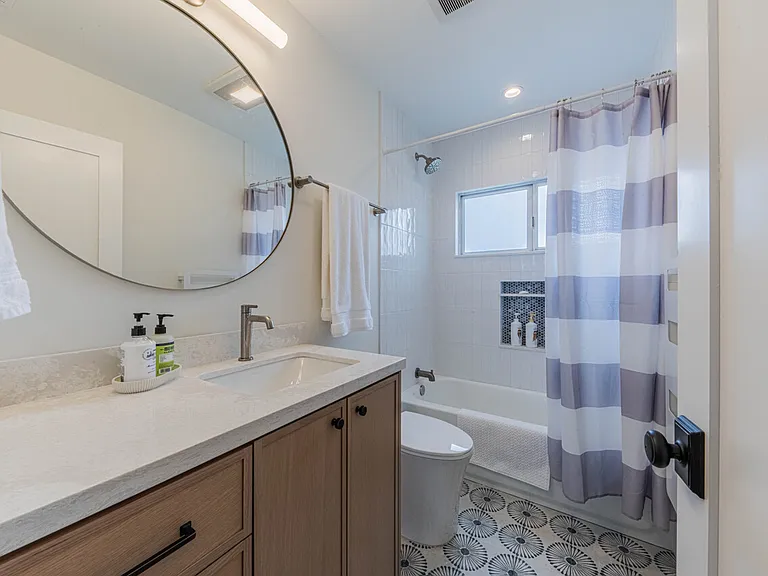 Guest Bath with Towel Heater and Shower over Tub
