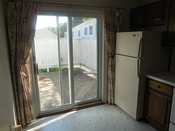 Kitchen w/slider to fenced patio.