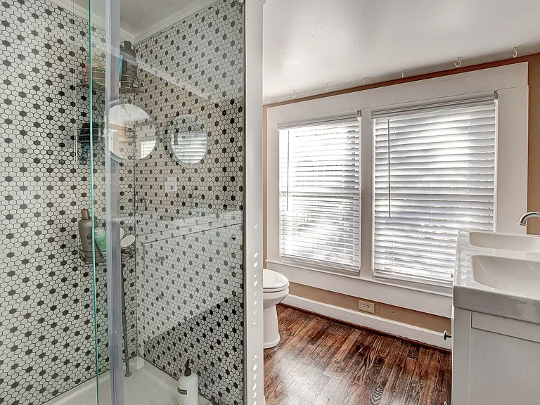 2nd fllor walk up attic shower, double vanity sink and toilet