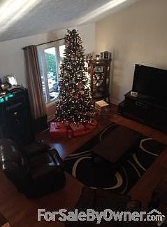 Vaulted Ceilings & Laminate Flooring
						:
						This is a view from the top of the stairs.