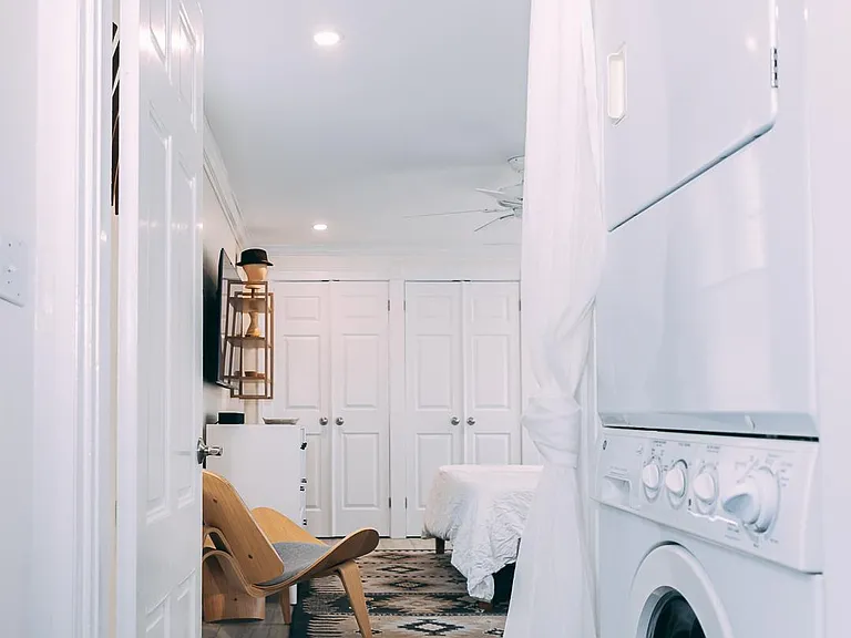 The unit has its own washer/dryer near the master bedroom.