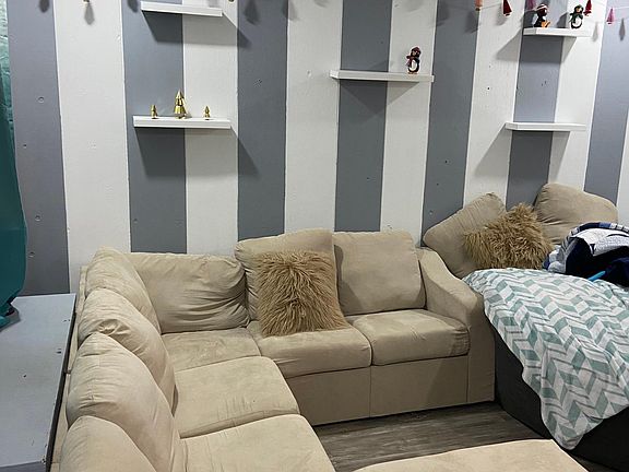 When you walk into the house you'll be welcome to the living room and open floor to dining room as well