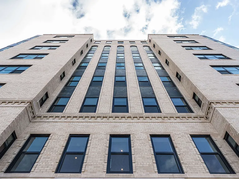 Fully renovated exterior of the Century apartment building preserving its historic charm