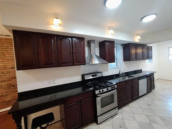 Kitchen 
Elegant marble countertops paired with stainless steel GE appliances _ a clean, modern finish that blends style and functionality. ____
