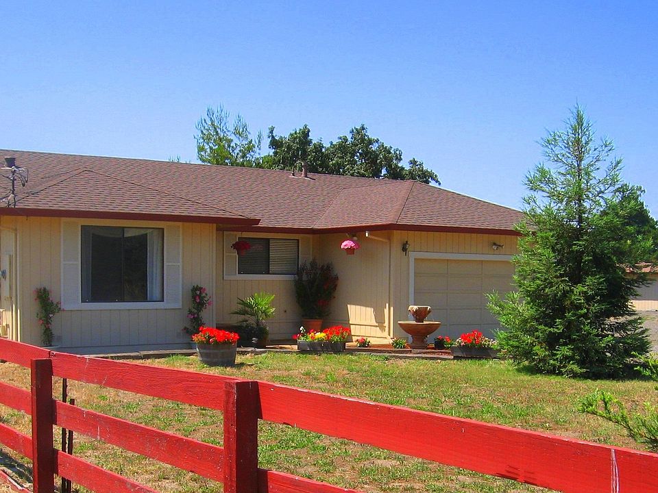 House from front yard main pasture area opposite house, another to left