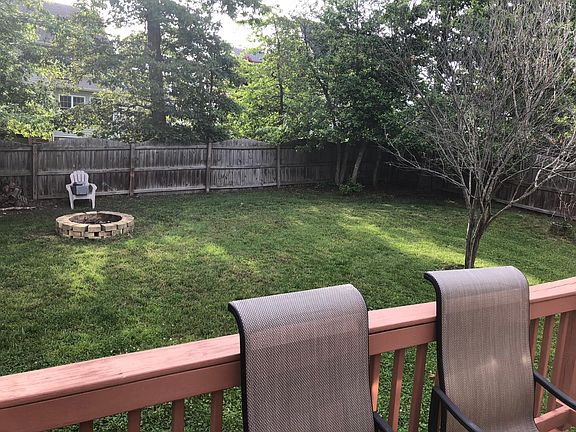 Backyard w/stone fire pit