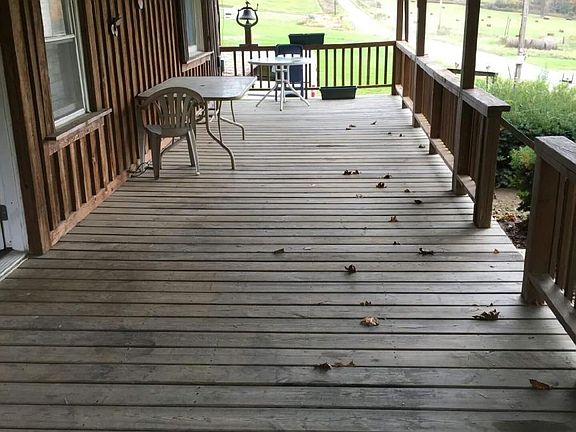 Front porch overlooking large pond