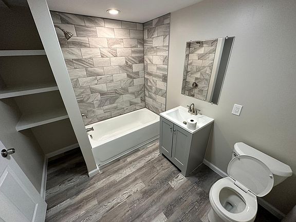 Main floor full bathroom with storage.