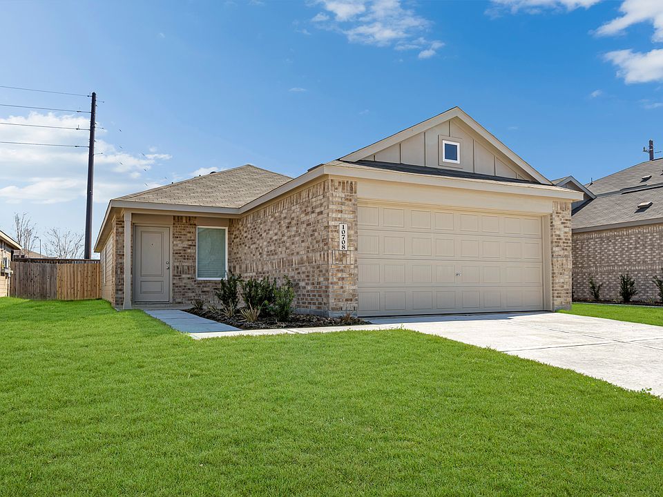 Newly built 1,400sqft single-story home with brick exterior, attached two-car garage, and clean, low-maintenance landscaping!