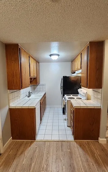 Kitchen has brand new dishwasher and stove