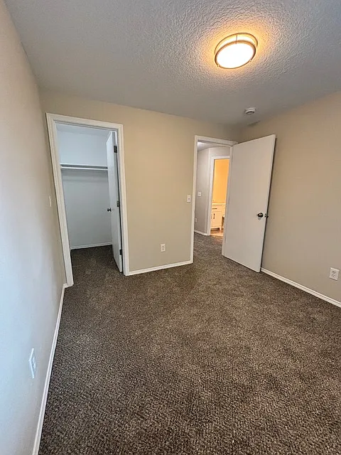bedroom w/walk in closet - 57 SW 206th Ave