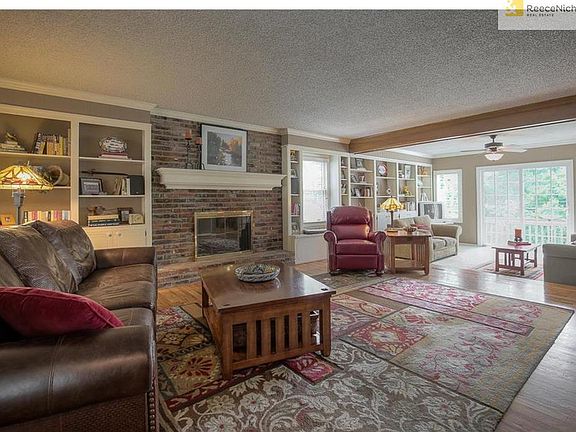 Family room features lovely built-ins, fireplace and additional den/study room.