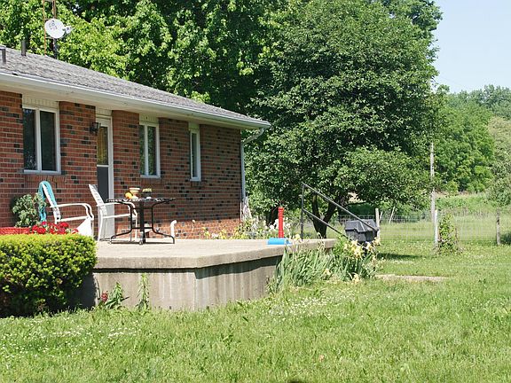 Back of house faces the south and the pasture and is a beaut